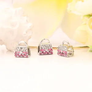 Drei silberne Handtaschen-Charms mit rosa Strasssteinen und Schleife für DIY-Armbänder