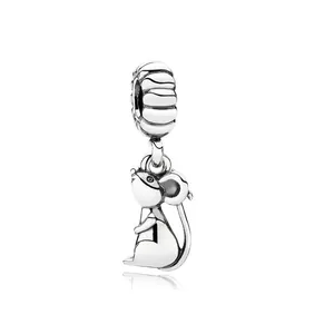 Macro detail of silver rat zodiac charm with textured hanging ring for DIY jewelry