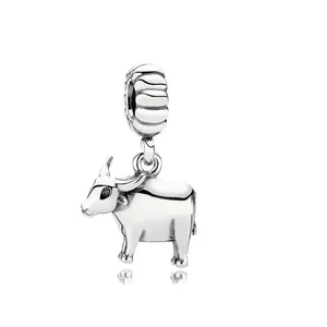 Detailed view of a polished silver ox charm with black eye accents for DIY jewelry