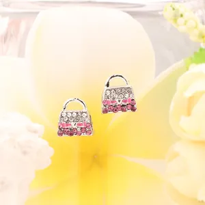 Elegante handtaschenförmige Silberohrstecker mit Strasssteinen und rosa Schleife