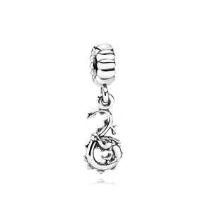 Macro shot of vintage silver dragon charm bead for DIY necklaces and bracelets