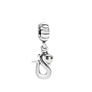 Detailed view of a silver snake charm with black zircon eyes for DIY jewelry
