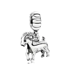 Detailed close-up of a silver sheep charm featuring intricate horns and polished metal