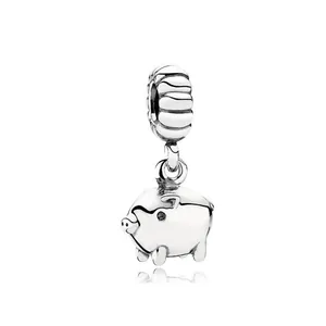 Detailed view of silver-toned pig charm bead with black zircon eyes for DIY jewelry