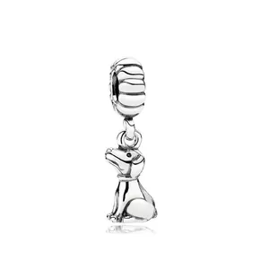 Detailed macro view of silver zodiac dog charm with stripe pattern bead loop