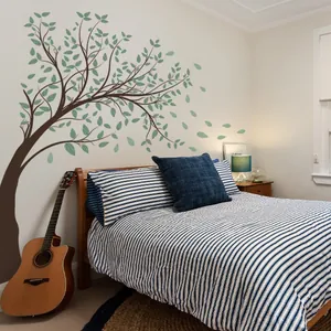 Large green tree wall decal with falling leaves for a cozy bedroom background decor