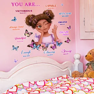 Detail of wall stickers featuring African girl, butterflies and motivational quotes in girl's room