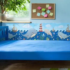 Bordure de papier peint baleine et voilier bleu océan pour chambre d'enfant