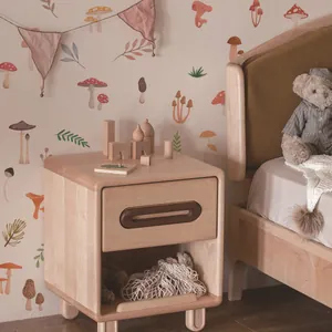 Detail of solid wood bedside table for kids room with mushroom wallpaper background