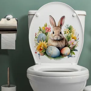 Détail de l'autocollant lapin de Pâques à l'aquarelle posé sur un couvercle de WC