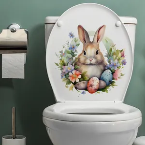 Sticker de lapin de Pâques à l'aquarelle et œufs fleuris sur abattant de WC blanc