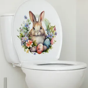 Sticker lapin de Pâques et œufs colorés aquarelle sur un couvercle de toilette
