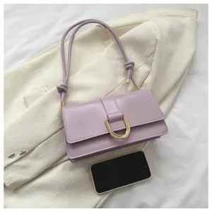 Light purple leather underarm bag with gold horseshoe buckle and size reference