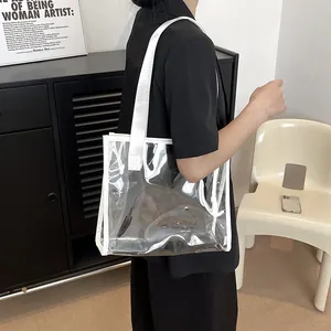 Minimalist transparent PVC tote bag with white webbing handles for stylish daily commute