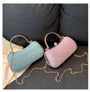 Chic sequined evening clutches in light blue and pink with elegant gold metal handles