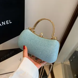 Light blue glitter hard case clutch with gold metal handle and chain shoulder strap