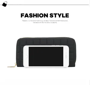 Detail of black checkered long wallet with gold zipper and smartphone for size reference