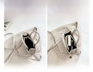 Detailed interior of a white leather crossbody bag with multiple storage compartments