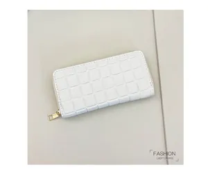 Detail of white checkered embossed long wallet for women with golden metal zipper