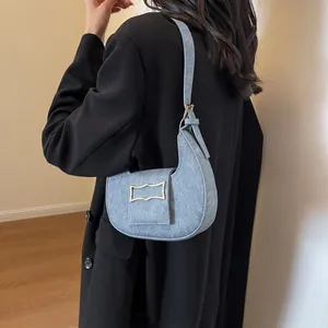 Stylish light blue crescent shoulder bag with golden geometric buckle for women