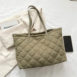 Quilted olive green tote bag with diamond stitching and minimalist shoulder straps