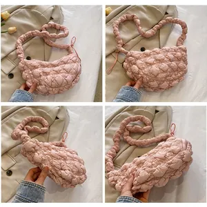 Pink quilted cloud dumpling bag with puffy texture and scrunchie shoulder strap