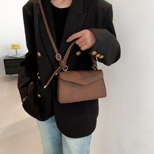 Minimalist vintage brown PU leather crossbody bag with unique leather knot handle and gold rings