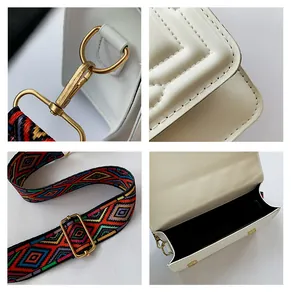 Detail of white quilted handbag featuring gold hardware and colorful woven shoulder strap