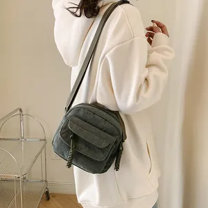 Retro olive green corduroy crossbody bag with woven rope zipper for women's casual style