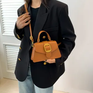 French style caramel leather crossbody bag with gold woven buckle and top handle for women