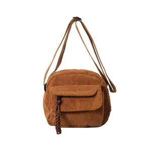 Brown corduroy crossbody bag for women with adjustable strap and front flap pocket