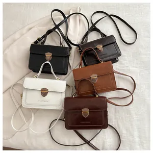 Vintage flap crossbody bag in matte leather with shield lock and adjustable strap