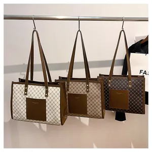 Close-up of three vintage canvas tote bags in cream, light tan, and dark brown colors