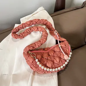 Quilted pleated cloud bag in coral pink with elegant pearl strap and half moon shape