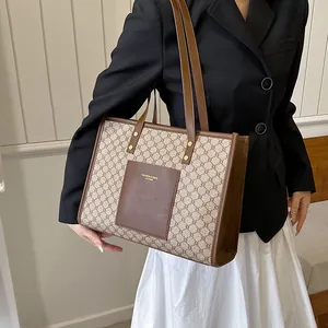 Large vintage geometric monogram tote bag with brown leather trim for women's daily commute