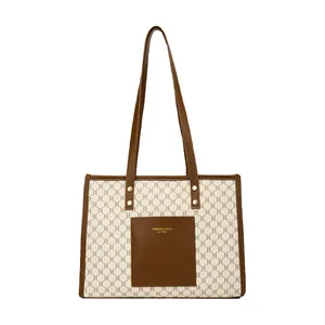 Large capacity tote bag with cream geometric pattern and brown shoulder straps