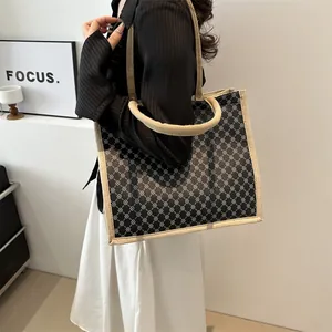 Linen patchwork tote bag with geometric patterns and beige handles for daily use