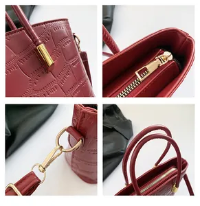 Detailed views of wine red tote bag featuring square embossed texture and gold hardware