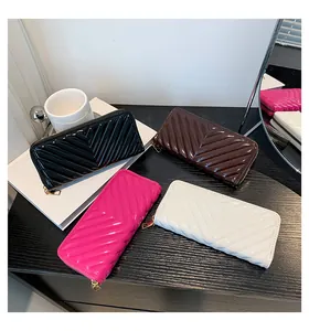 Detailed display of glossy V-quilted patent leather long wallets in four elegant colors