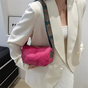 Magenta leather Boston bag with vintage ethnic patterned woven strap for daily styling