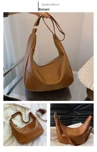 Detail view of brown large capacity moon-shaped shoulder bag in premium PU leather