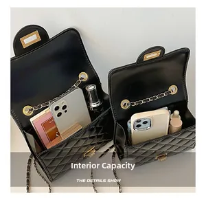 Detail view of the quilted chain bag showing interior capacity for phone and cosmetics