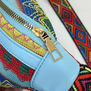 Macro detail of ethnic woven fabric with colorful geometric patterns and metal zipper
