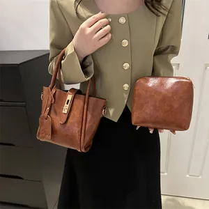 French retro brown leather bucket shoulder bag set with fashion tag on model