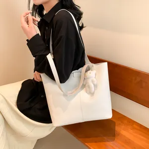Retro white faux leather tote bag with vertical stitching and cute plush bear charm