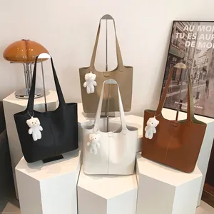 Minimalist large leather tote bag in four colors with a cute plush bear charm