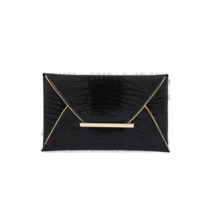 Modern black envelope clutch bag with crocodile texture, glitter panels and gold metal clasp
