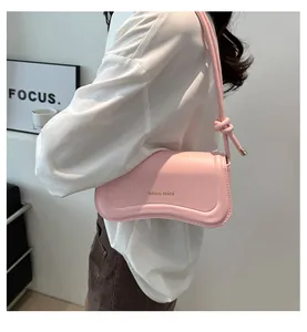 Detail of light pink curved shoulder bag with Miss mini logo and knotted leather strap