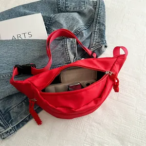 Vibrant red nylon crescent chest bag with adjustable strap and zipper closure