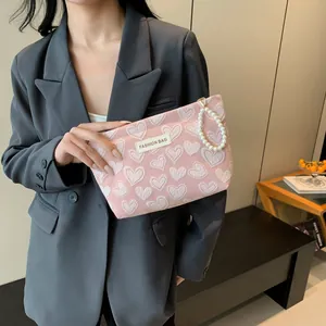 Pink heart patterned large makeup bag with pearl handle and Fashion Bag label